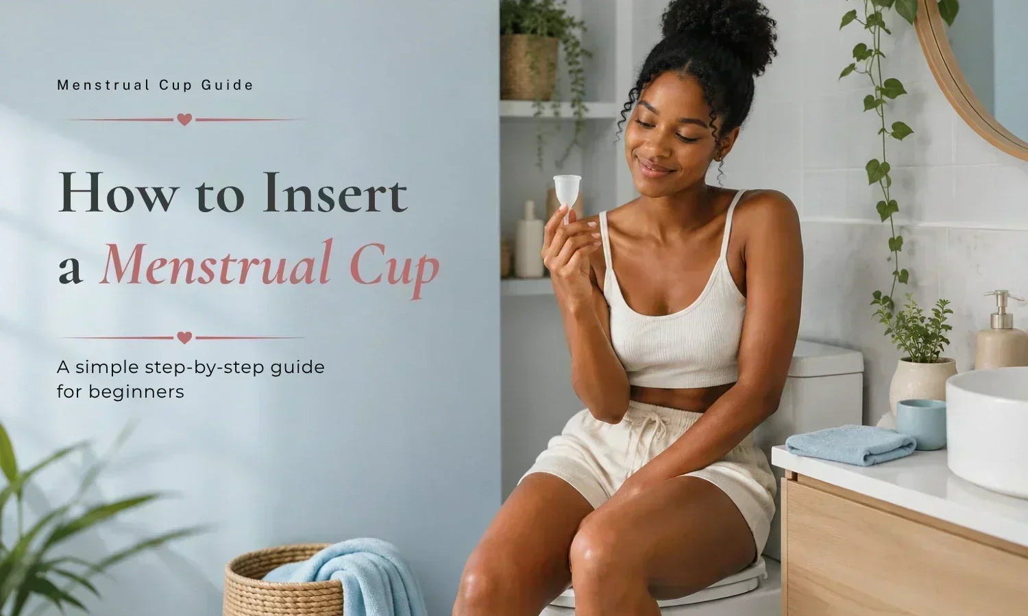 Woman holding a menstrual cup in a bathroom for a beginner's guide to menstrual cup insertion