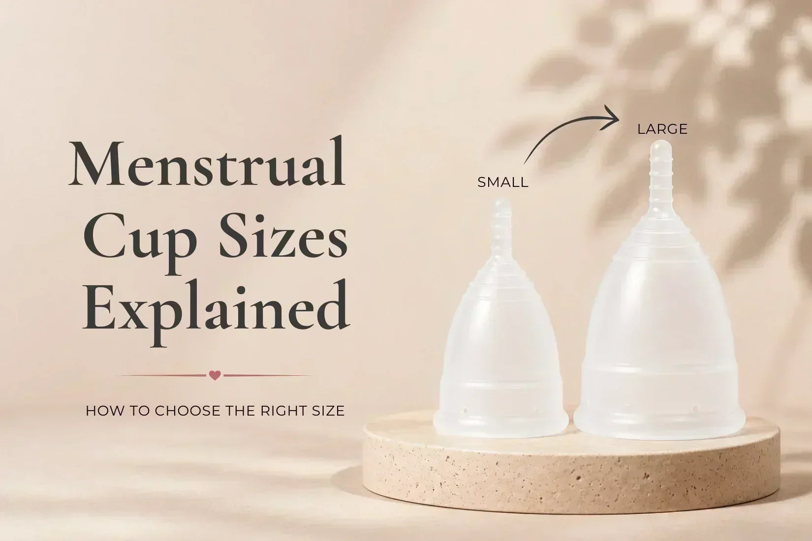 Small and large Flo Angel menstrual cups on a neutral stone pedestal for a menstrual cup size guide.