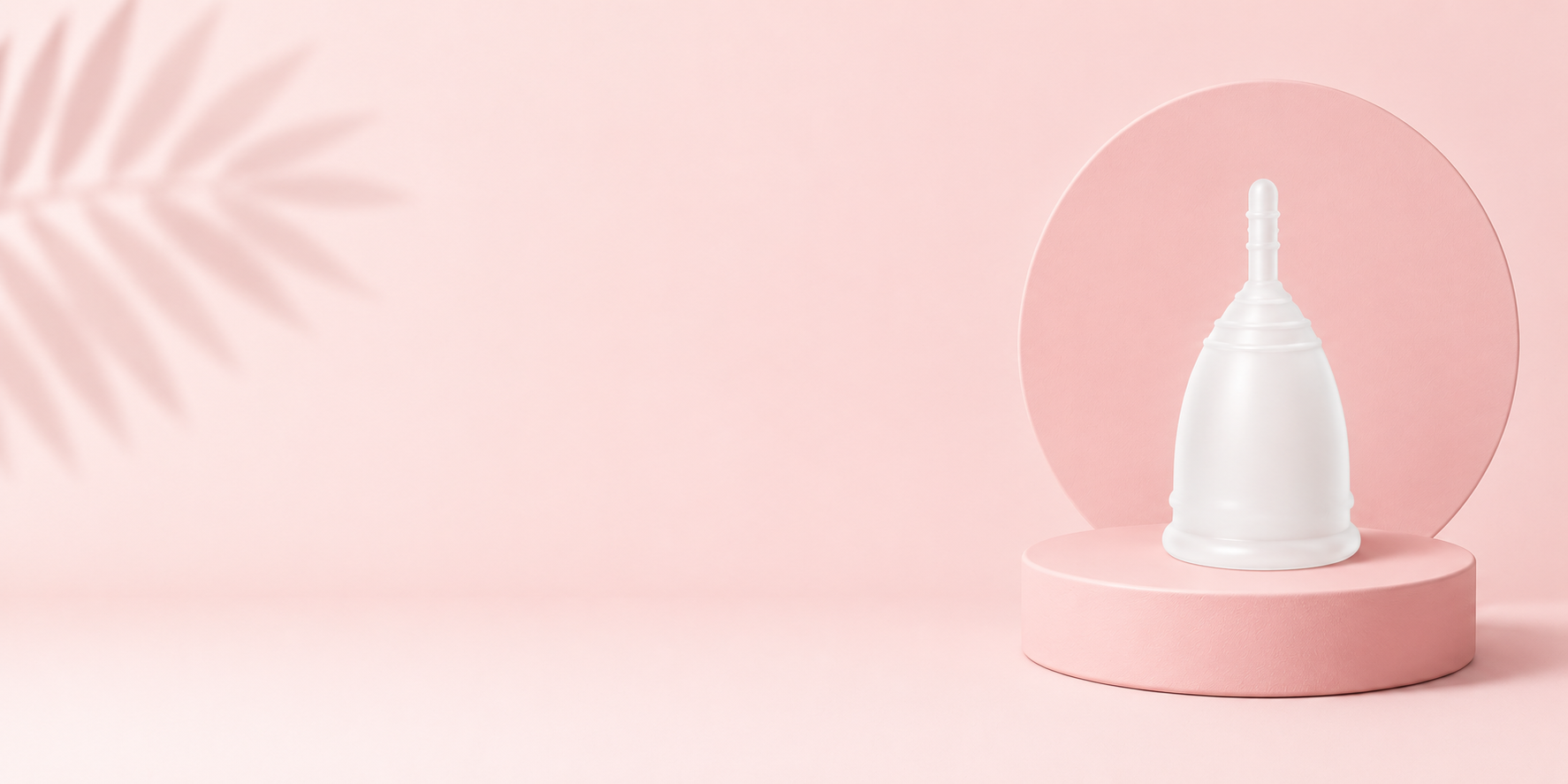 Flo Angel menstrual cup displayed on a pink podium for frequently asked questions about sizing, insertion, cleaning and period care