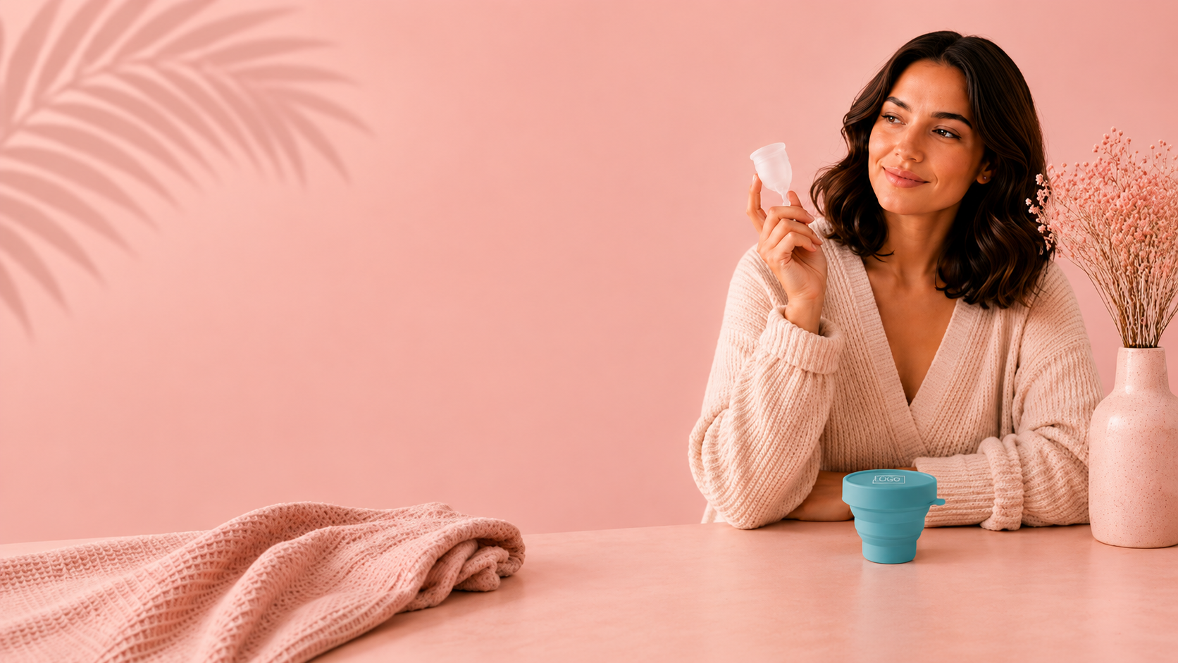 Woman holding a Flo Angel reusable menstrual cup on the shop page for premium leak-free period care in South Africa